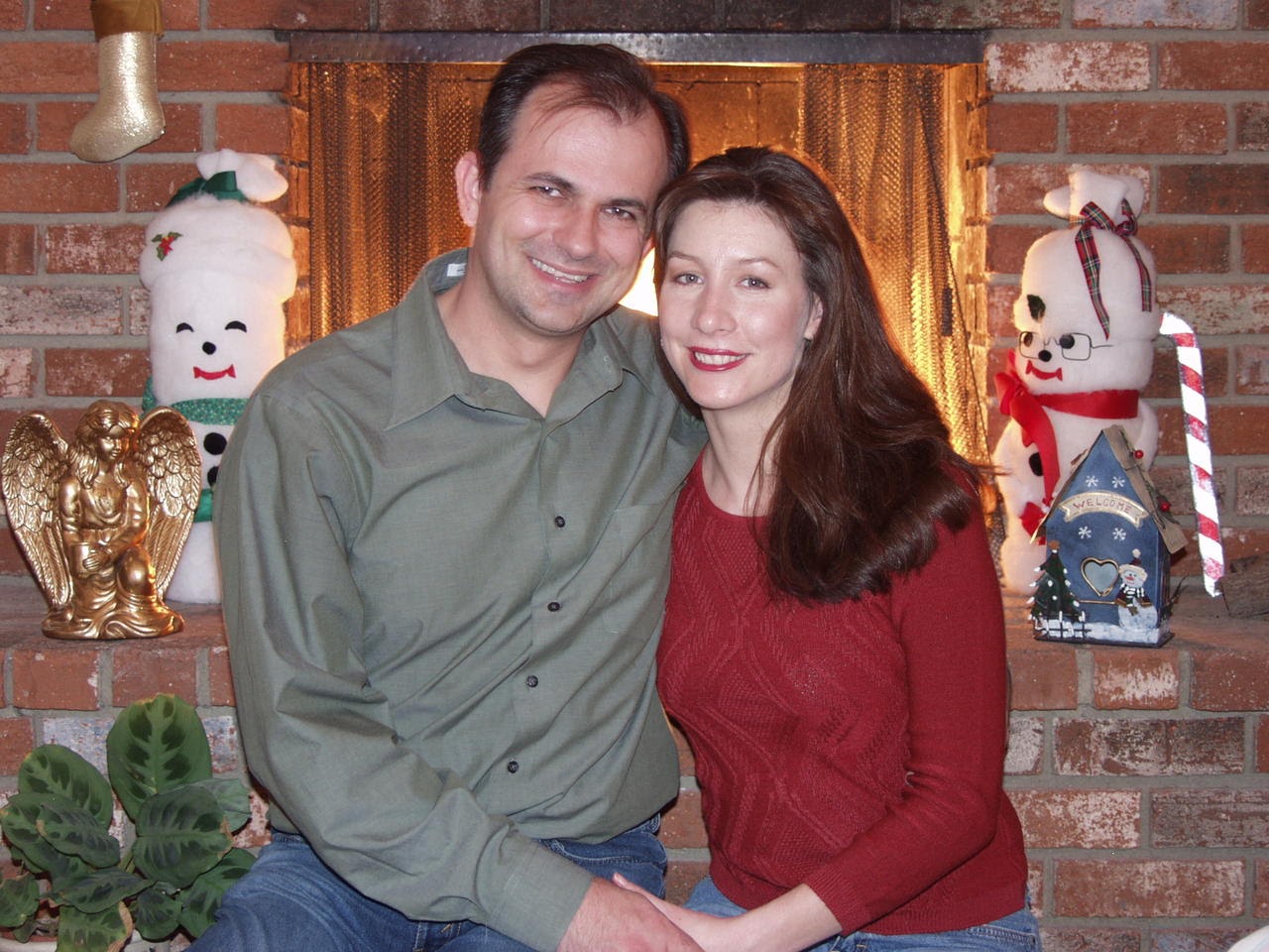 Themio and Christian by the fireplace at Christmas 2002